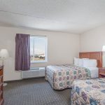 Two beds in two room suite at Days Inn and Suites Wildwood