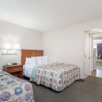 Two beds in two room suite at Days Inn and Suites Wildwood