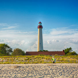 Cape May lighthouse with sandy shore in front